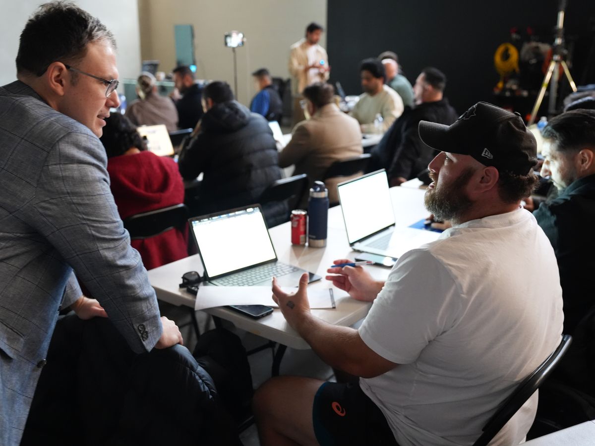 Working through one attendee's numbers at their laptop