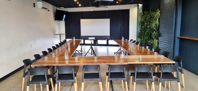 The Barkly Room at the Plough Hotel, set up for the workshop with tables in a U facing a projector screen