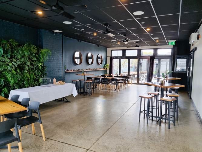 The Barkly Room from the other end, high tables and glass doors opening onto the courtyard